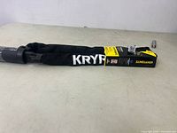 Full view of black Kryptonite Keeper 790 Combo Chain with packaging showing the chain sleeve and lock end