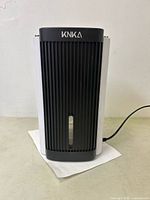 Front view of KNKA dehumidifier showing black vent grille and KNKA logo