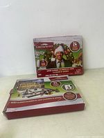 Front view of one National Lampoon's Christmas Vacation advent calendar showing the cover art with Chevy Chase dressed as Clark Griswold and the box indicating 24 days of surprises.