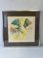 Framed abstract watercolour painting with circular motif in green, yellow, brown tones, signed Jordan 1975.
