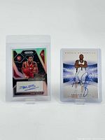 Two signed basketball rookie cards displayed, one of Kobe Bufkin with a patch autograph and one of Antonio Burks numbered to 1499.