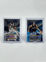 Front view of the two signed Topps Finest basketball cards featuring Reece Gaines and Aleksandar Pavlovic in protective sleeves.