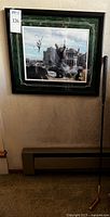 Framed Arnold Palmer photograph hanging on wall