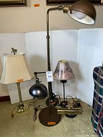 Image showing all five lamps together with various shades and metal finishes, highlighting size variety and style.