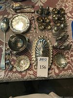 Overview of all 22 pieces on lace cloth