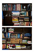 Photo of multiple dark wood bookshelves filled with books of various sizes and colors, showing a diverse collection of genres and formats.