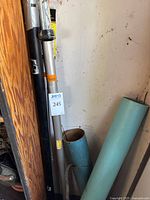 Photo of fishing rods and storage tubes showing wear and arrangement.