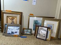 Full view of all nine framed art prints with size tags and frame styles visible