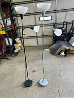 Full view of both floor lamps showing color differences and bases