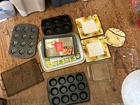 All items laid out including bakeware, plates, tray and dishes