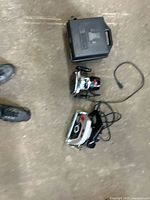 Overall view of router, saw, case and cord