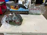 Three items grouped: Sagamore Hill miniature, Jonah and the Whale bank, second home miniature