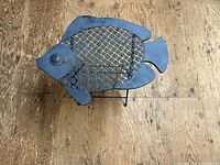 Top view showing fish silhouette and lattice metal top