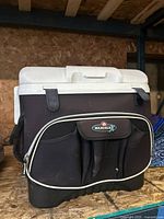 Front view of Igloo MaxCold rolling cooler showing zippered pocket and exterior