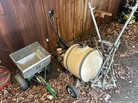 John Deere spreader beside liquid sprayer showing overall lot