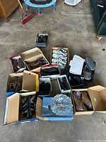 Overview of boxed men’s shoes various types and glass bowl