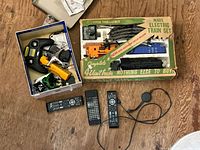 Overview of train set box, drone parts box and separate remotes