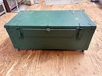 Closed trunk front view showing latches and wheels