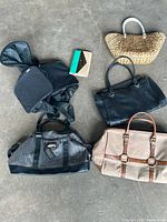 Overview of all six bags and wallet on floor