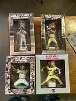 Four boxed Philadelphia Phillies bobblehead figurines displayed together