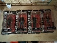 All four sealed Sons of Anarchy figures laid out