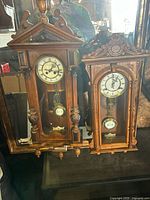 Both RA clocks side by side showing overall design and size comparison