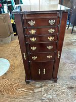 Front view closed, showing six drawers and lower cabinet