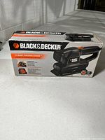 Front of boxed Black & Decker 1/3 sheet finishing sander