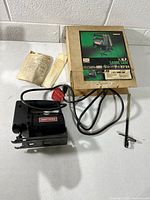 Saw, box, manual, blades, wrench on table