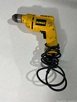 Left side profile of DeWalt DW106 drill with coiled cord