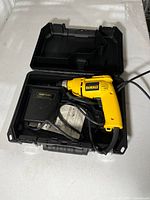 Open case showing drill, Craftsman accessory, manual