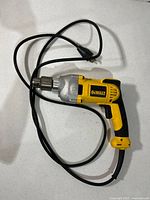 Full view of DeWalt corded drill with cable