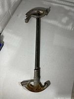 Full view of conduit bender showing head and handle