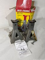Two Larin jack stands, manual, box visible