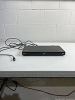 Front view of LG BD570 Blu-ray player with power cord