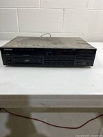 Front view of Pioneer PD-M455 CD changer showing controls and cartridge slot