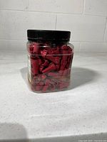 Jar filled with red wire nuts