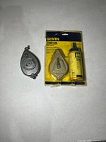 Both chalk line reels and chalk bottle overview