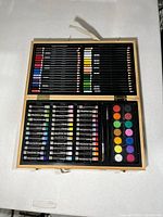 Open art kit showing all supplies neatly arranged