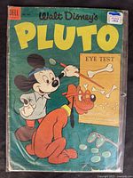 Front cover of the 1953 Walt Disney Pluto comic book showing Mickey Mouse and Pluto with an eye test theme, with visible wear and aging on the cover.