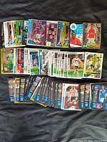 Spread of over 100 assorted soccer trading cards featuring various professional teams and players from different leagues.