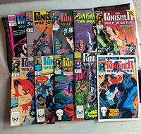 Ten Punisher comic books laid out showing front covers with colorful artwork mostly featuring Punisher and action scenes.