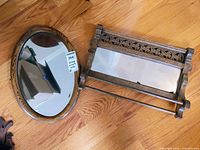 Both vintage wood-framed wall mirrors shown on wood floor.