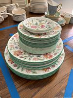 Top-down view of full stack showing scalloped rims and floral design