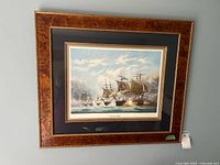 Full view of the framed and matted print showing the naval battle and frame details.
