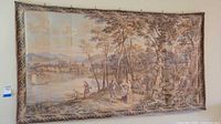 Front view of large colonial themed tapestry showing full detailed pastoral scene with figures, trees, and distant city.