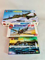 Three Airfix model kit boxes: Avro Lancaster B1 Special, Messerschmitt BF 109F, HMS Ajax.