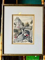 Full view of the framed print showing the historical Quebec city gate and horse-drawn carriage scene with double mat and gold frame.