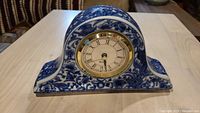 Blue and white ceramic mantel clock front view