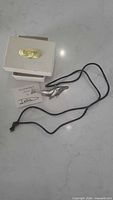 Necklace, gift box, information card